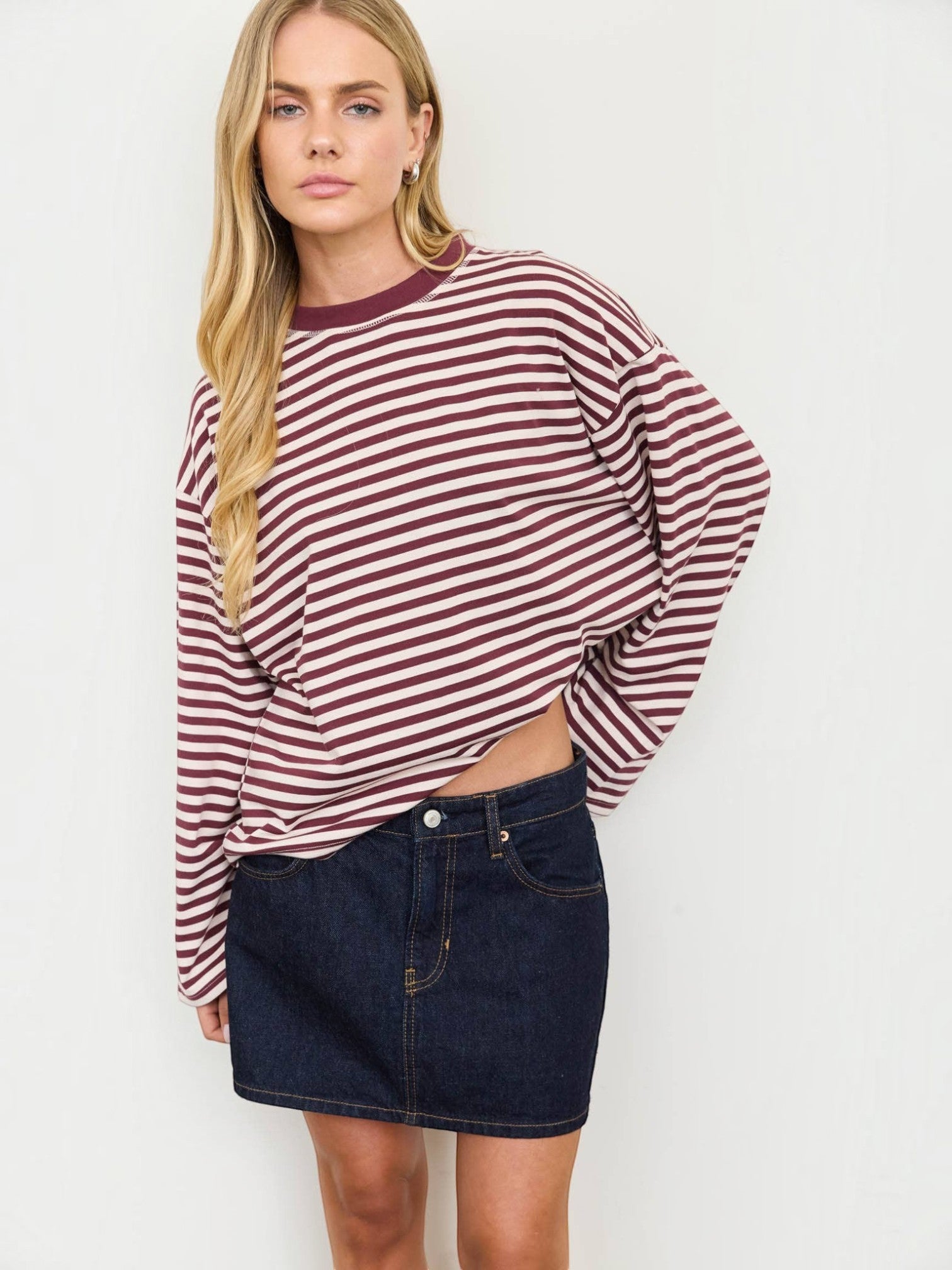 Mialur long-sleeve striped crew neck top with drop shoulders and contrast trim worn by a blonde model with a denim skirt.