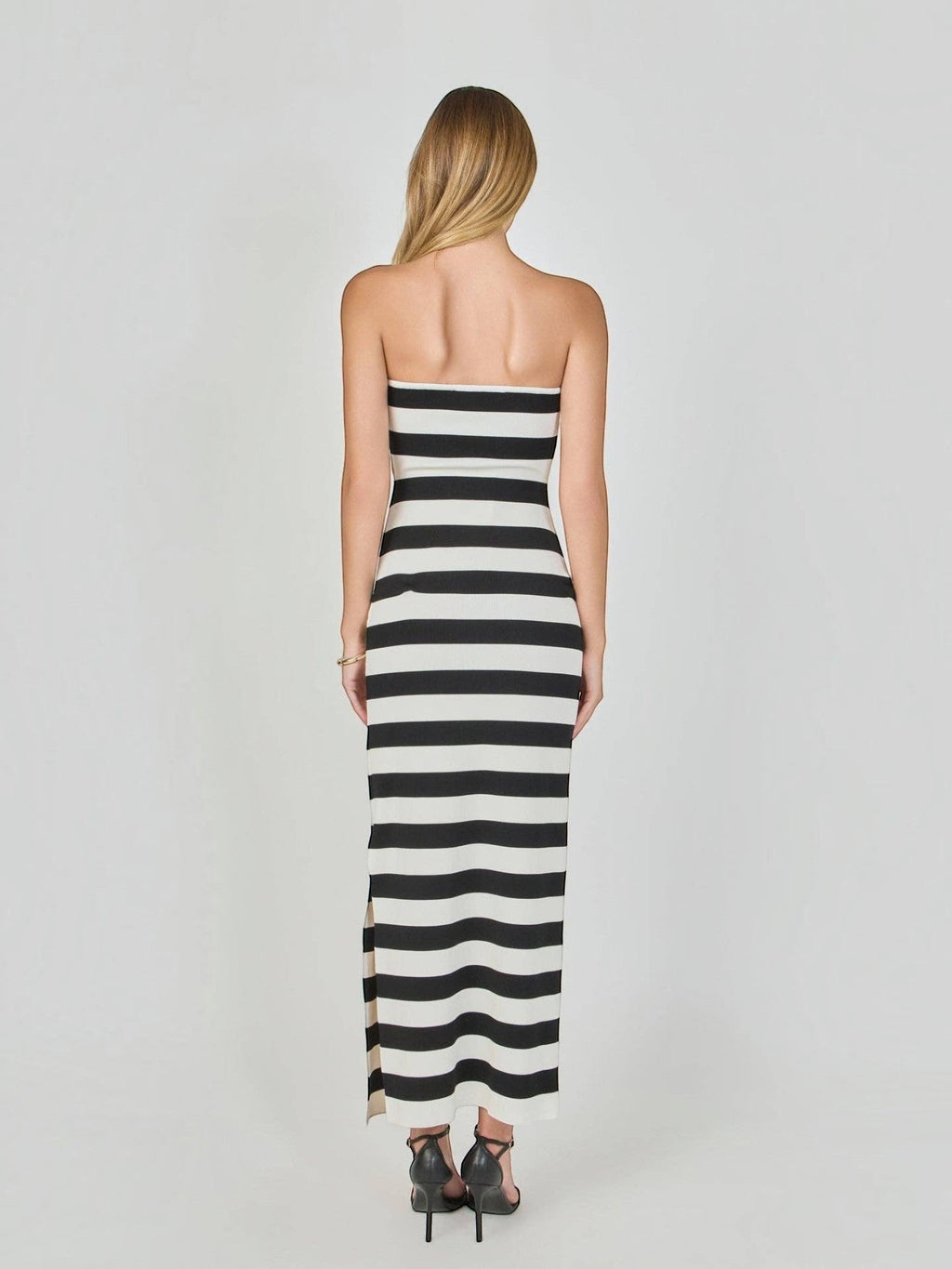 Mialur strapless maxi dress in black and white horizontal stripes, featuring a figure-hugging knit fabric, back view.