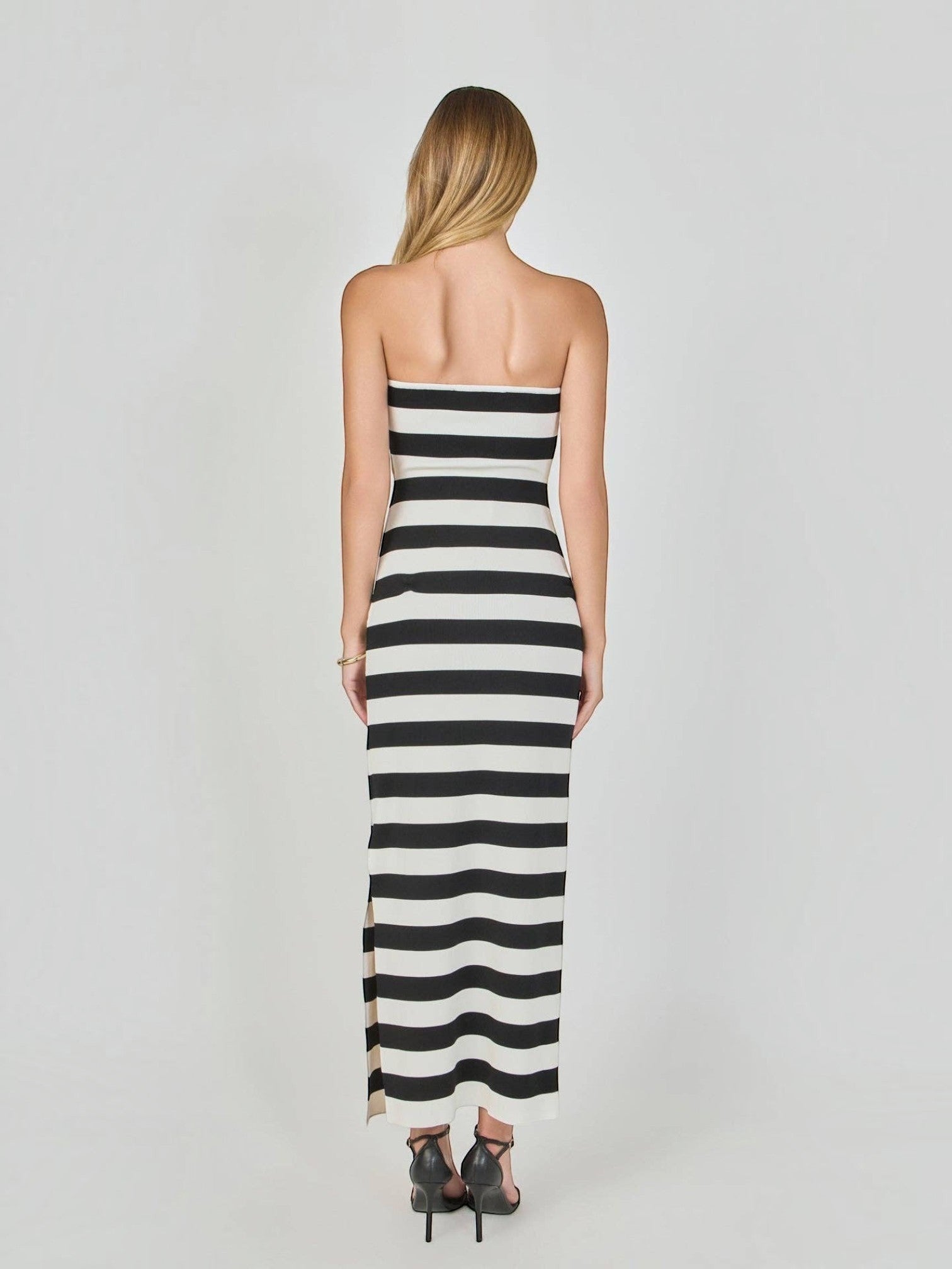 Mialur strapless maxi dress in black and white horizontal stripes, featuring a figure-hugging knit fabric, back view.