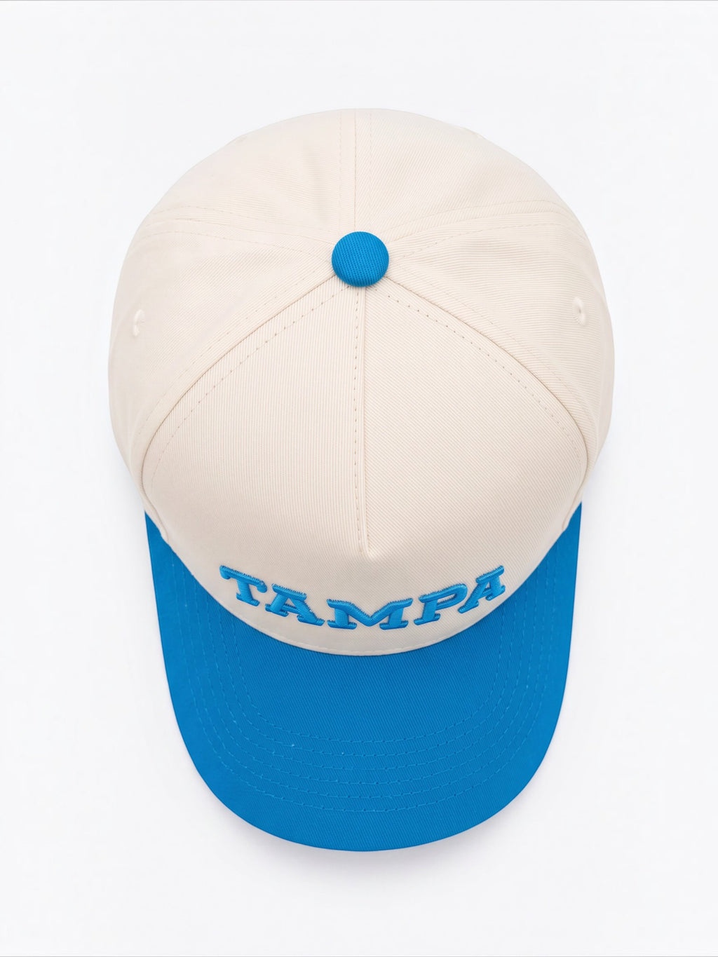 Mialur Tampa Coastal baseball hat in cream with a blue brim and blue embroidered TAMPA lettering on the front.