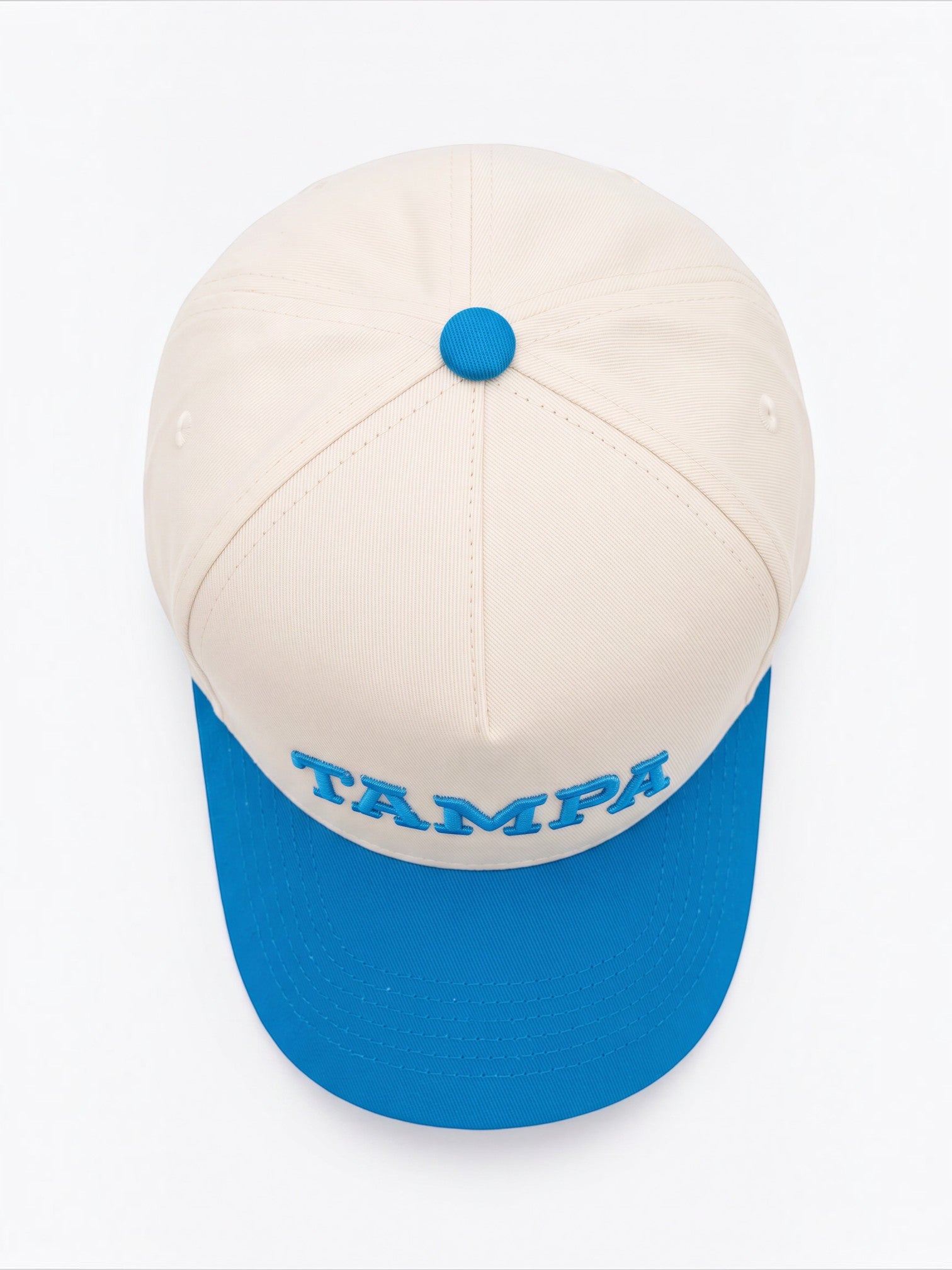 Mialur Tampa Coastal baseball hat in cream with a blue brim and blue embroidered TAMPA lettering on the front.