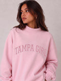 Mialur light pink mock neck sweatshirt with TAMPA GIRL graphic lettering worn by a model