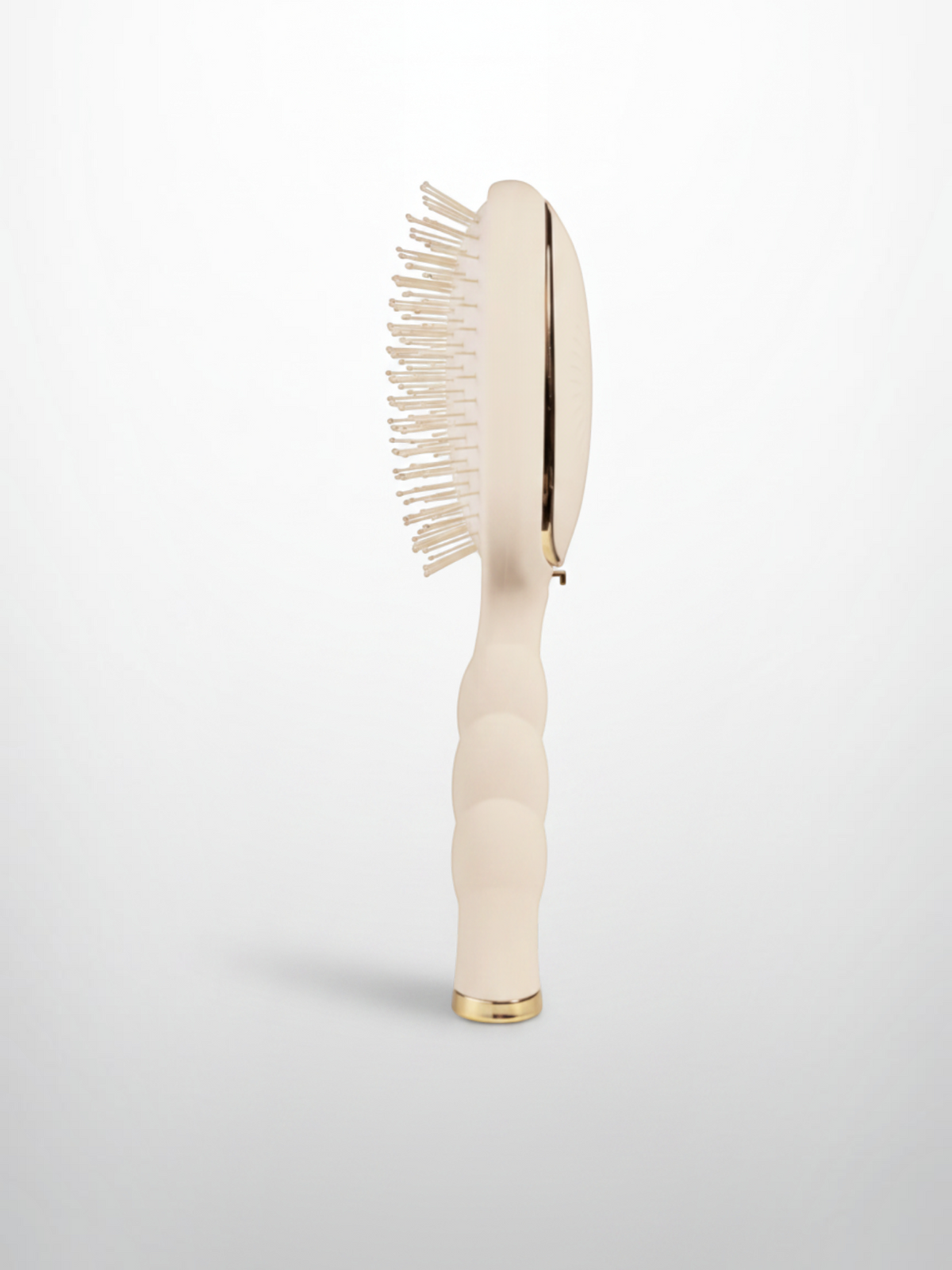 Mialur TELETIES tan detangler hair brush for medium hair with a coil-inspired grip and side profile view.