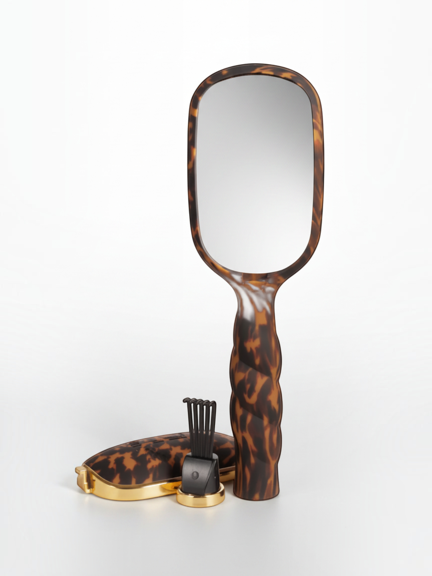 Mialur TELETIES tortoise shell detangler hair brush with a built-in mirror, gold hair pick, and storage compartment.