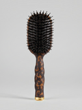 Mialur TELETIES boar bristle hair brush in tortoise pattern with a coil-inspired grip and gold accent