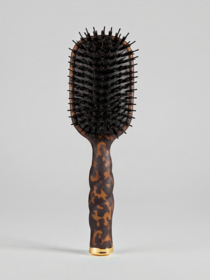 Mialur TELETIES boar bristle hair brush in tortoise pattern with a coil-inspired grip and gold accent
