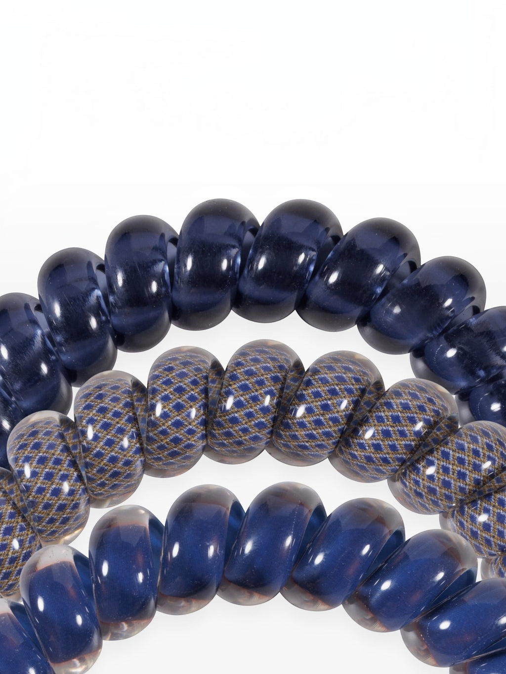 Mialur Twilight Tones large spiral hair ties in navy blue and patterned designs for a secure, crease-free hold.