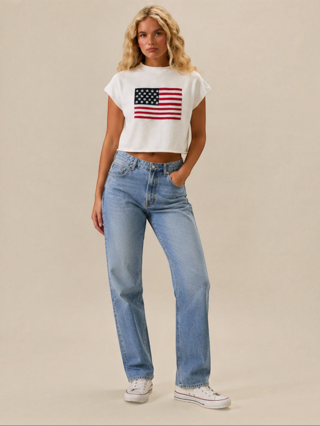 Mialur white mock neck top with American flag graphic, featuring a relaxed drop shoulder fit on a blonde model.