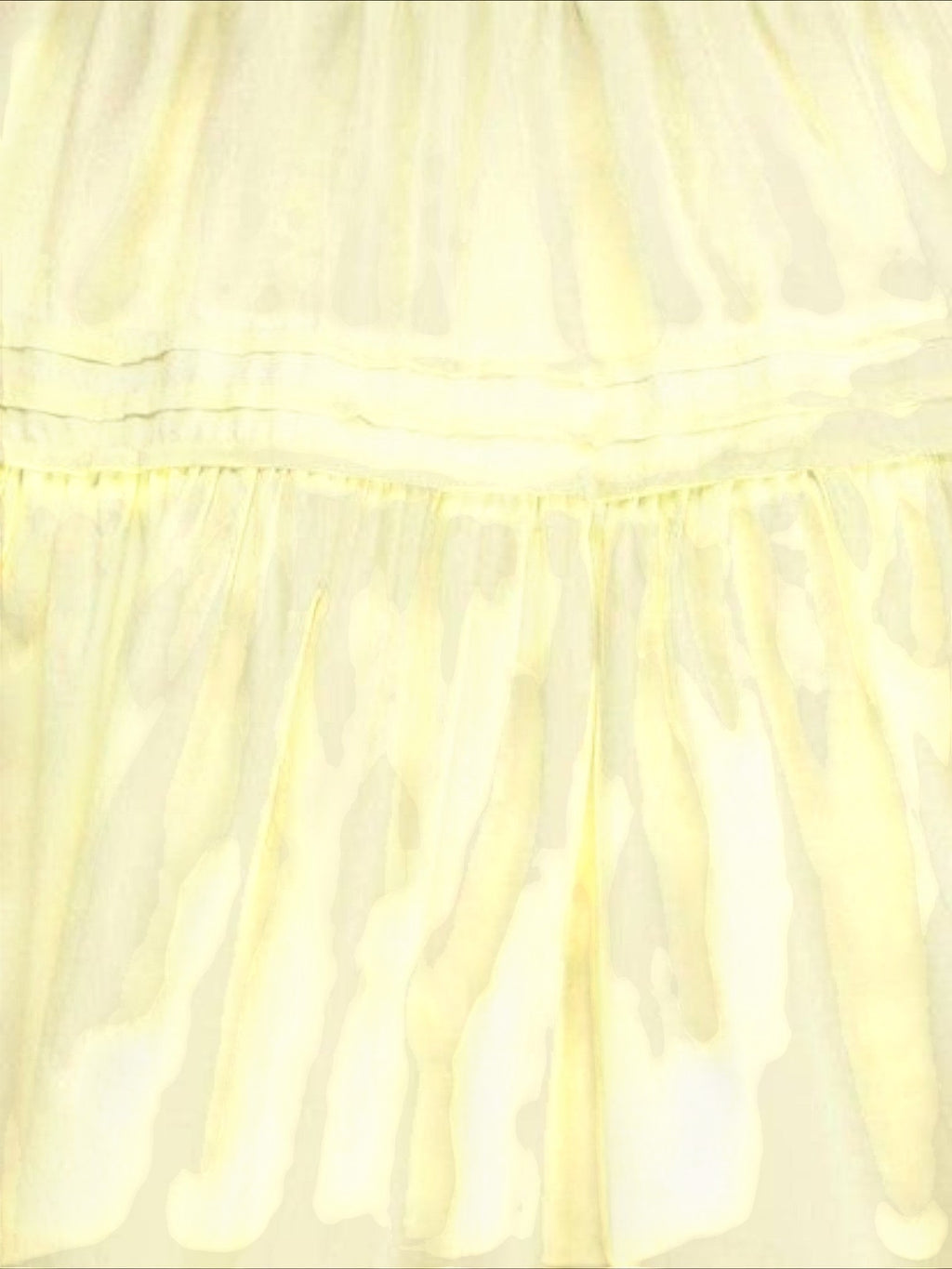 Mialur Valencia dress in butter yellow featuring a tiered skirt design with soft fabric folds.