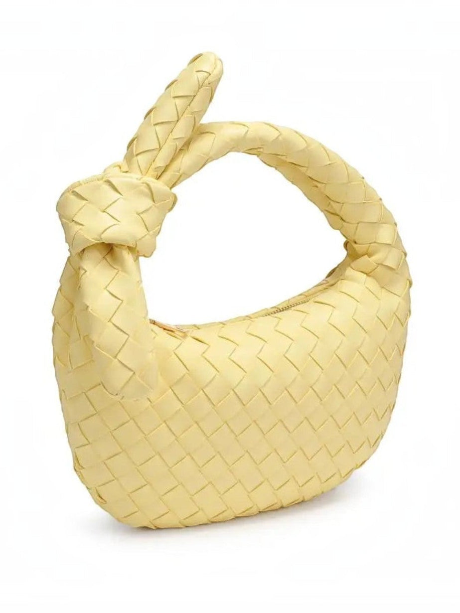 Mialur Verona bag in butter yellow vegan leather with a woven texture and a distinctive knotted handle.
