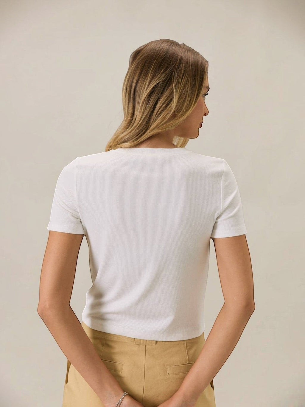 Back view of a woman wearing a Mialur white short-sleeve crew neck tee with a relaxed, slightly cropped fit.