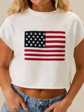 Mialur white mock neck top with American flag graphic and relaxed drop shoulder fit worn by a blonde model