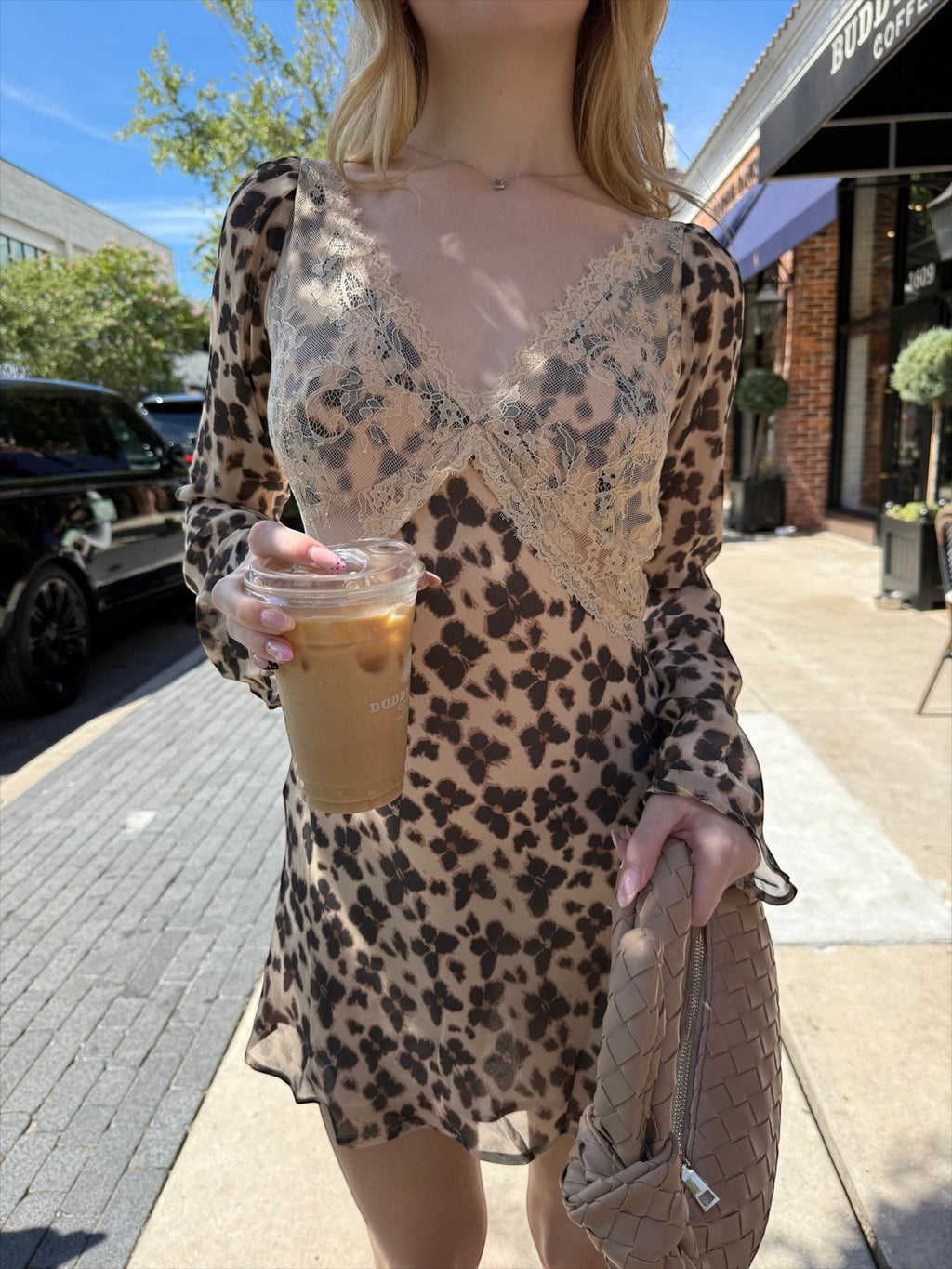 Mialur Wild Muse mini dress in brown and beige animal print with a deep V-neckline and delicate contrast lace detail.