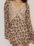 Mialur Wild Muse mini dress in brown and beige animal print with a deep V-neckline and delicate contrast lace detailing.