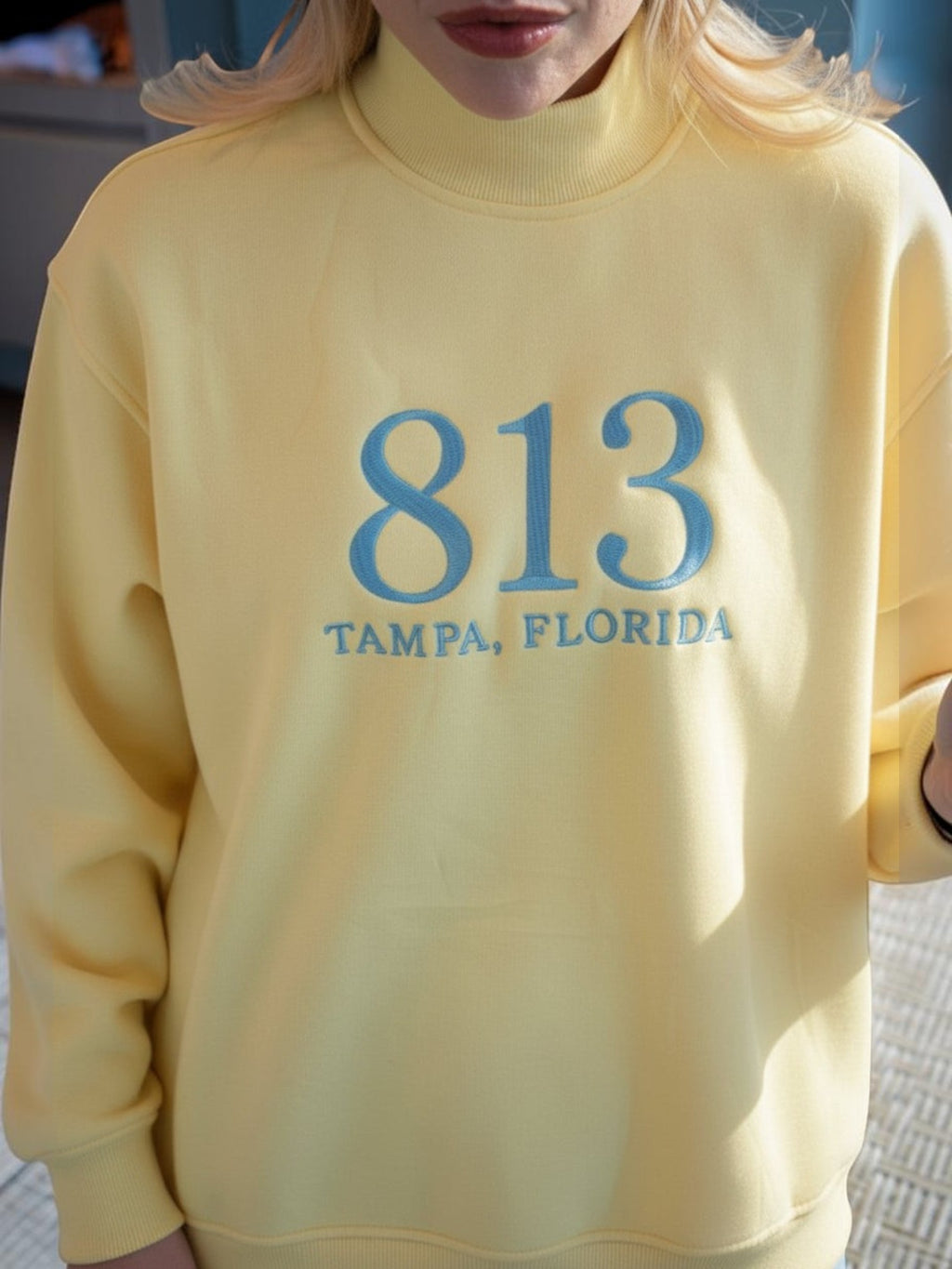 Mialur yellow mock neck sweatshirt featuring blue 813 Tampa Florida collegiate-style embroidery on the chest.